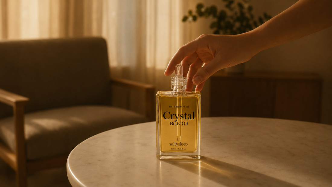 Crystal Body Oil bottle on a side table, a cool dark spot for storing body oil.
