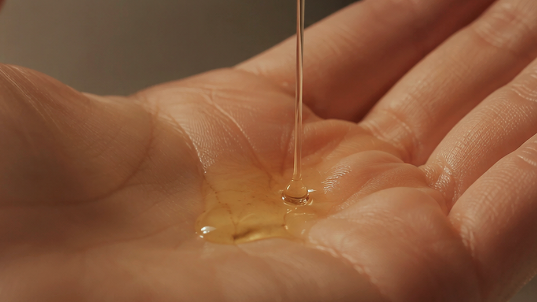Warm still-life of a post-shower body oil routine in soft light