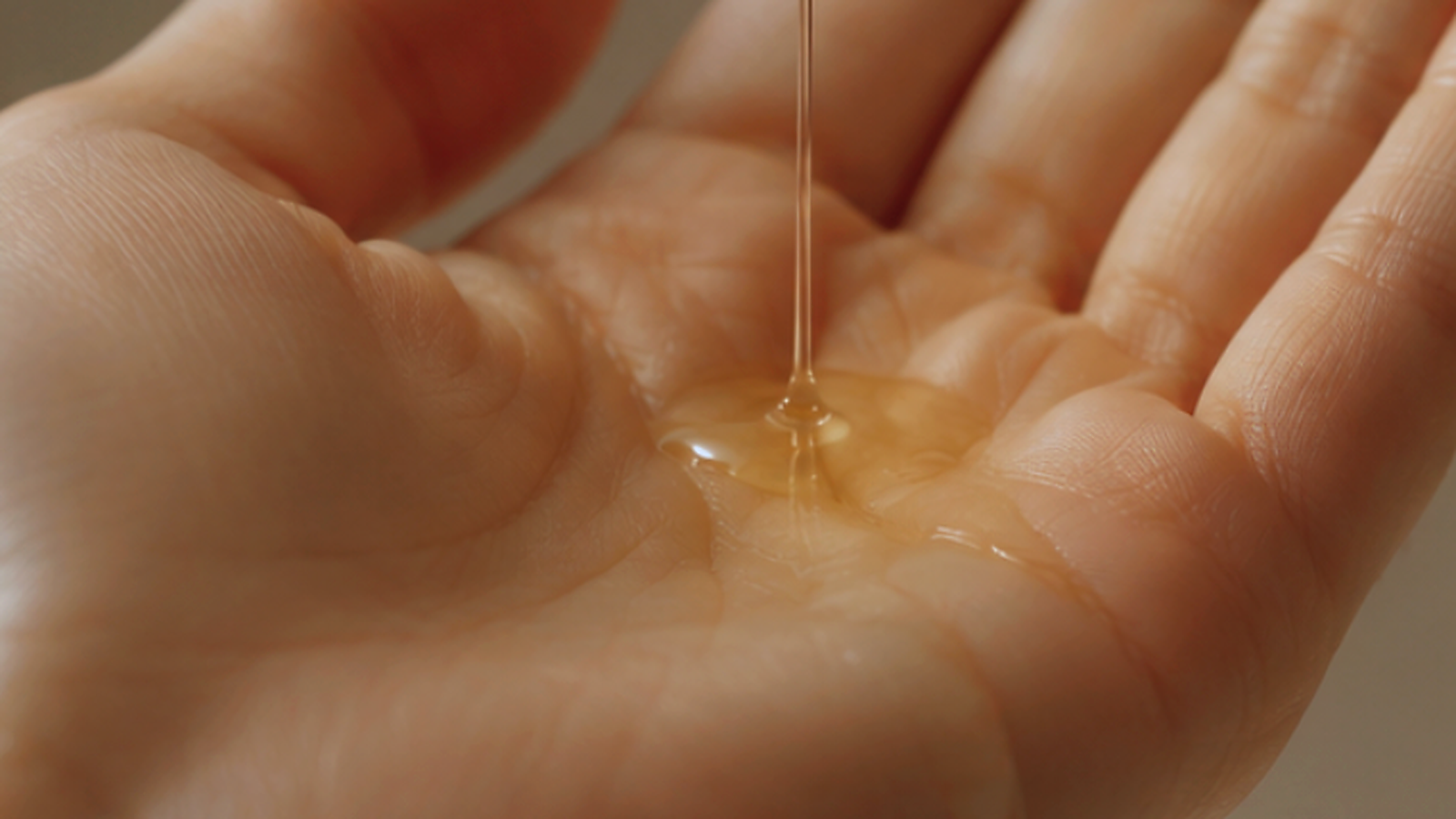 Warm still-life of a lightweight body oil in soft light